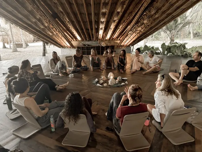 The group in circle at the retreat shala