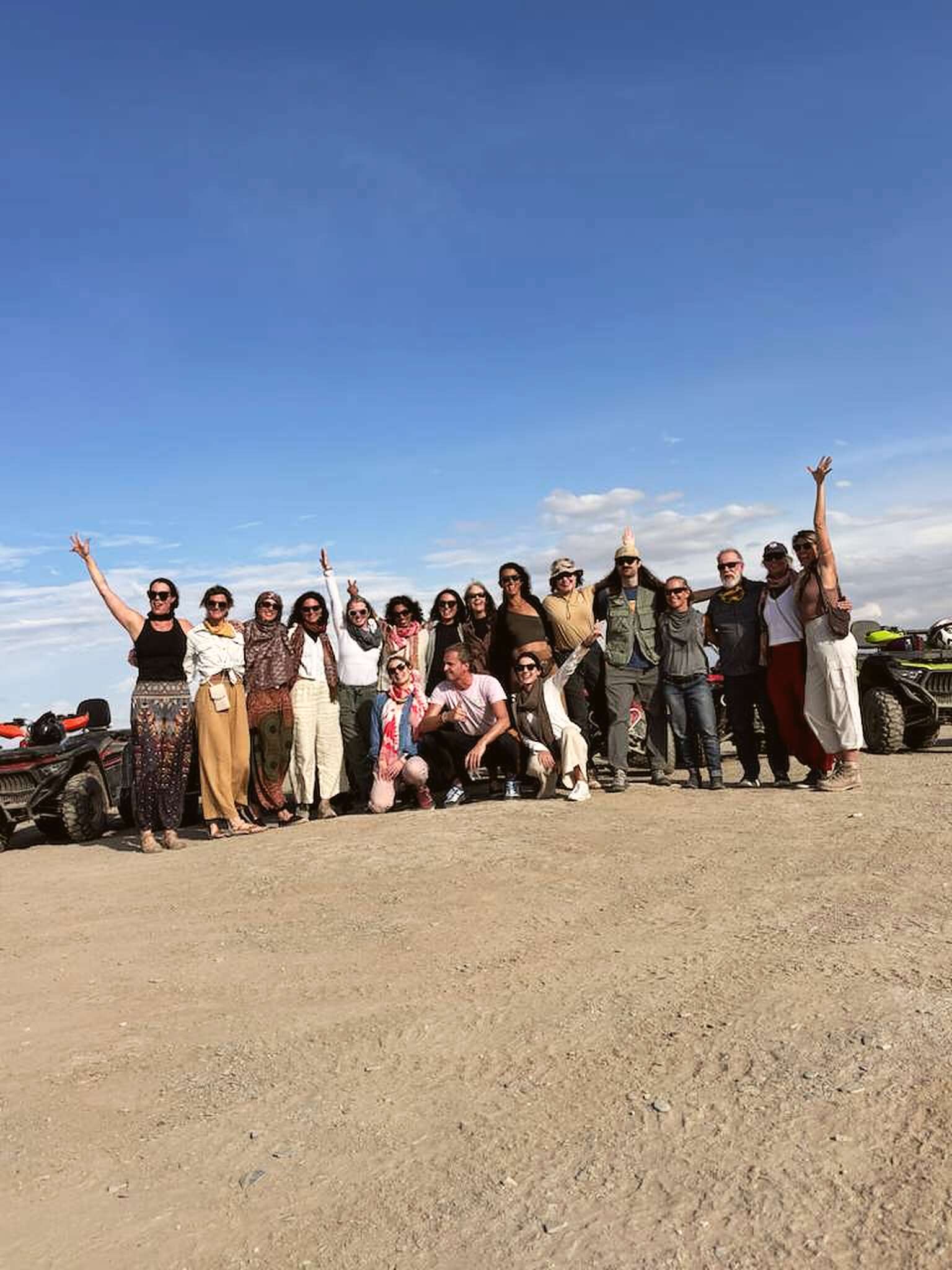 The Rebel group celebrating together in the Moroccan desert
