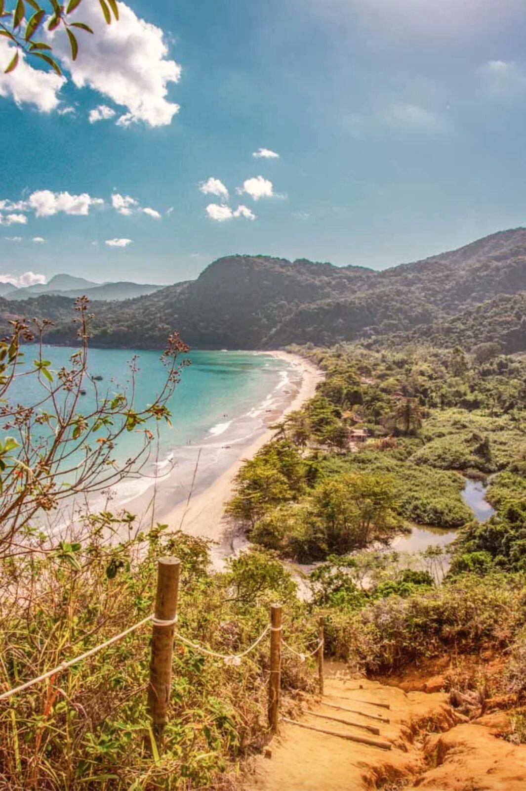 The green coast of Paraty, beach and rainforest from the trail