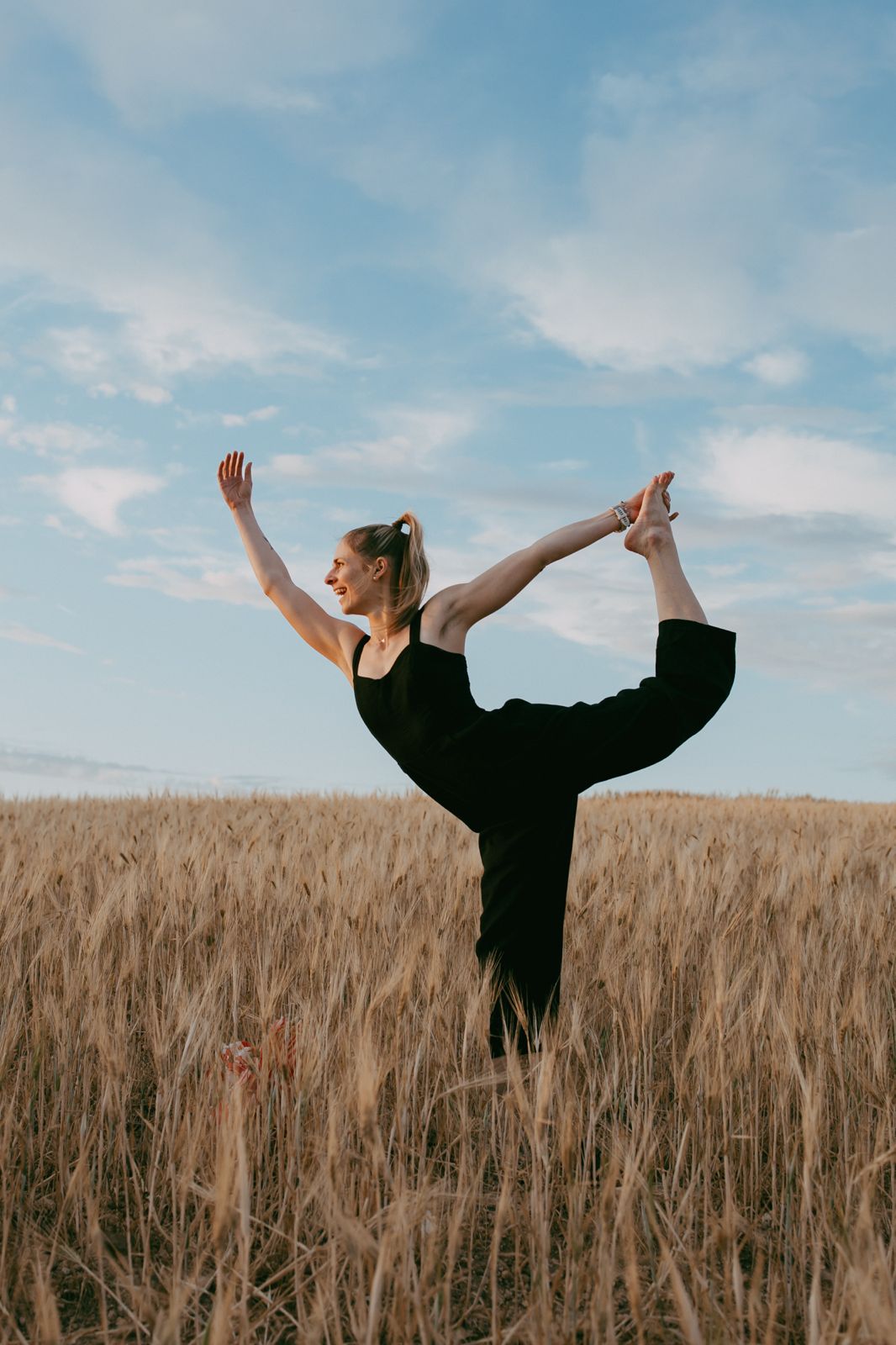 Dancer pose over the golden field